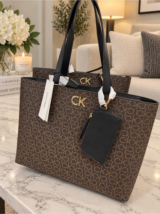 Calvin Klein Handbags - Calvin Klein Brown Monogram Tote with Black Handles and Gold Hardware